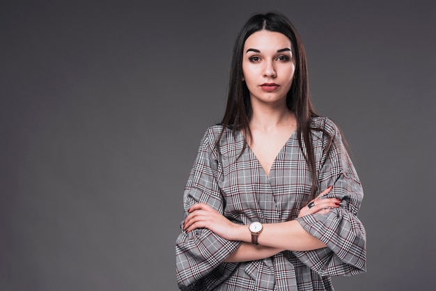 Woman with crossed arms looking at camera