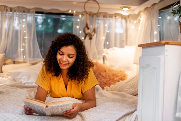 Free photo woman with curly hair reads