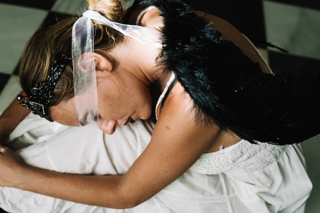 Free photo woman with dark angel wings sleeping