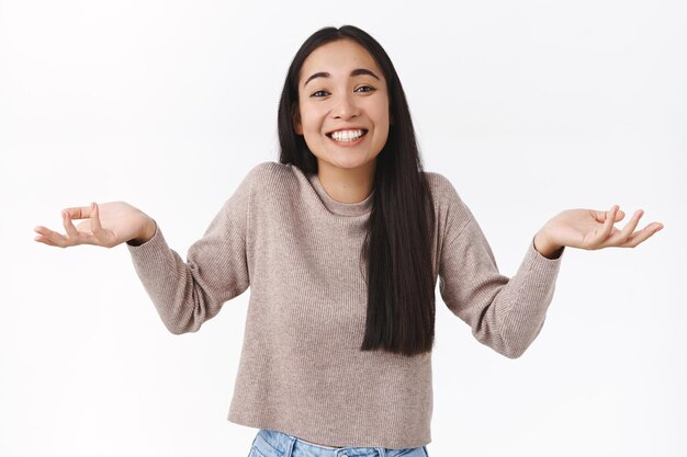 woman with dark hair, shrugging and spread hands sideways uninvolved, uninterested about topic