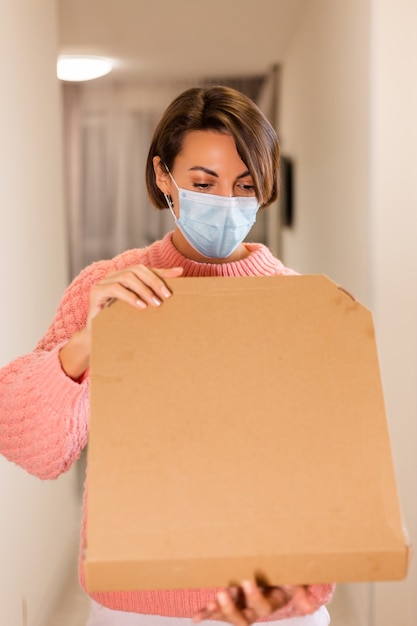 Woman with delivery pizza box