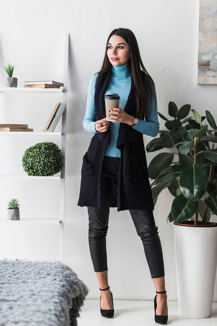 Free Photo woman with drink in stylish room