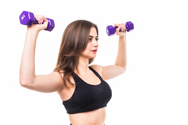 Woman with dumbbells working out and making different exercises