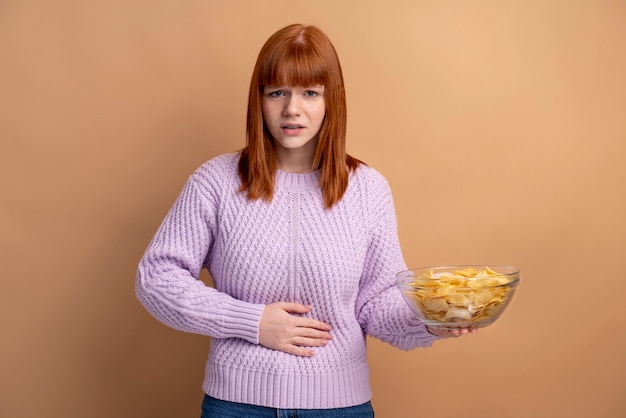 Woman with eating disorder having belly pain
