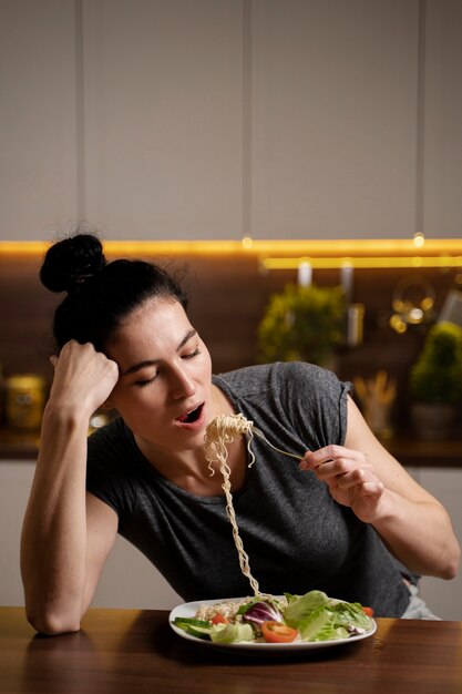 Free photo woman with eating disorder trying to eat healthy