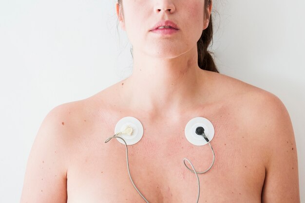 Woman with electrodes on body 