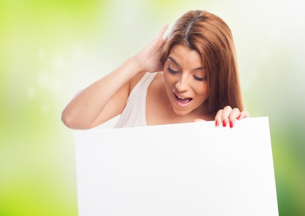 Woman with empty billboard