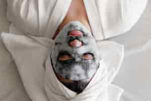 Free photo woman with face mask close up