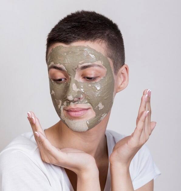 Woman with face mask looking down