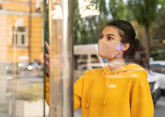 Woman with face mask and social distance concept