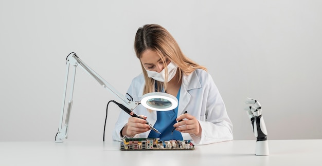 Free photo woman with face mask working