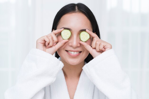 Woman with a facial mask in a spa