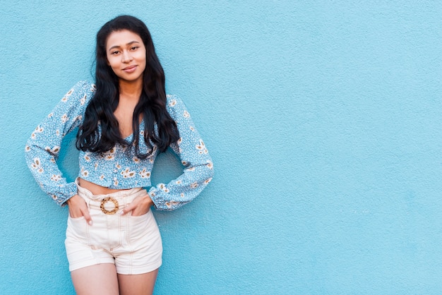 Free photo woman with floral shirt and copy space