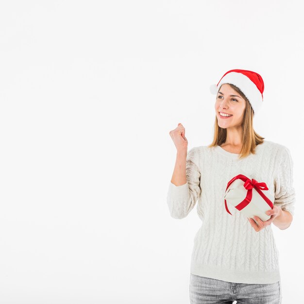 Woman with gift box showing fist