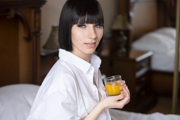 Woman with a glass of orange juice
