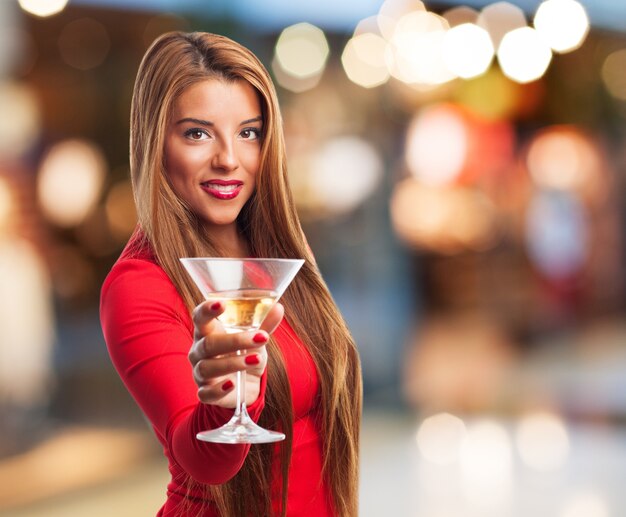 Woman with a glass in the street