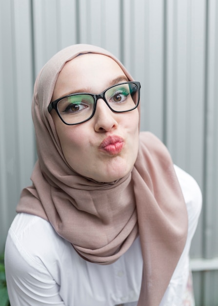 Free photo woman with glasses and hijab