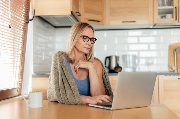 Woman with glasses and laptop during quarantine