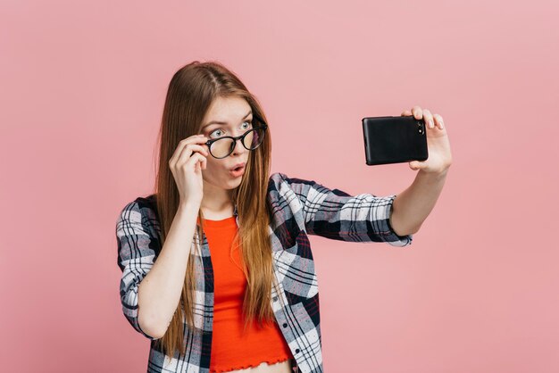Woman with glasses taking a selfie