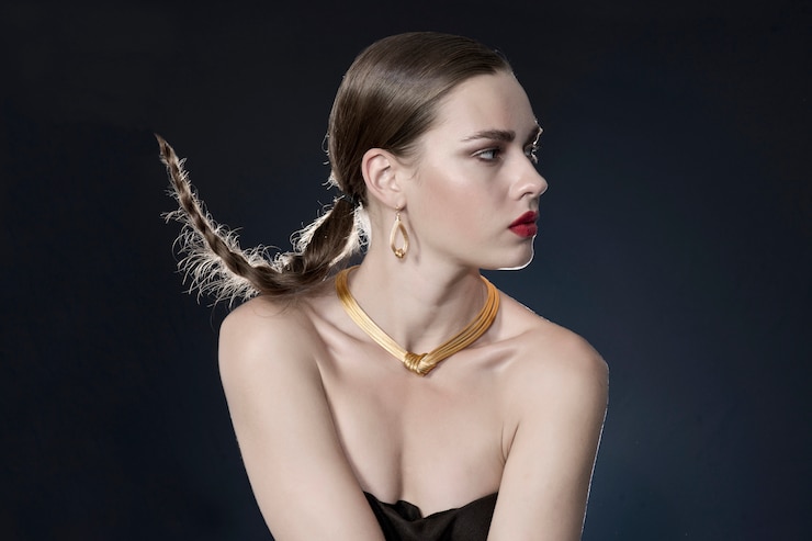 Free Photo woman with gold necklace