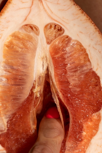 Woman with grapefruit top view