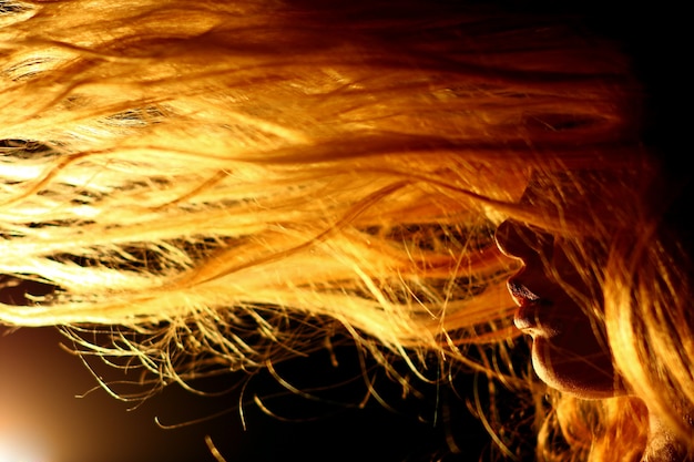 Woman with hairs in front of face