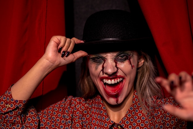 Free photo woman with halloween joker makeup laughing