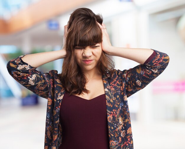 Woman with hands on head