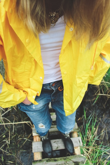 Woman with hands in pockets