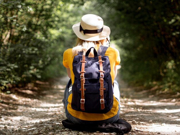 Woman with hat and backpack