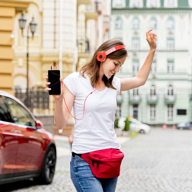 Woman with headphones dancing