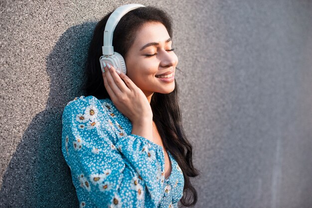 Woman with headphones enjoying