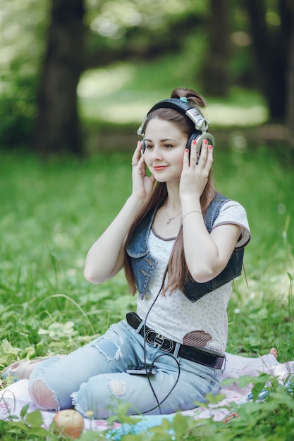 Woman with headphones listening to music