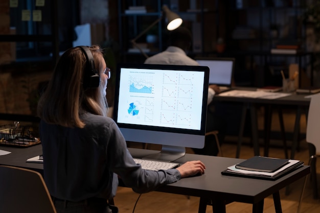 Woman with headphones working