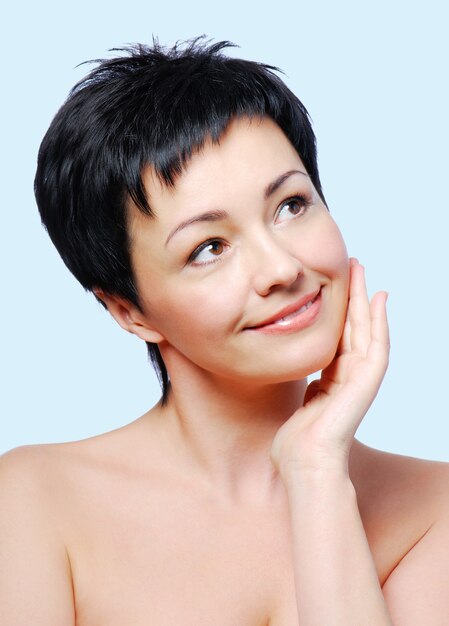 Woman with healthy condition of skin on a blue background