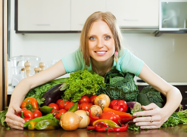 woman with heap of vegetables