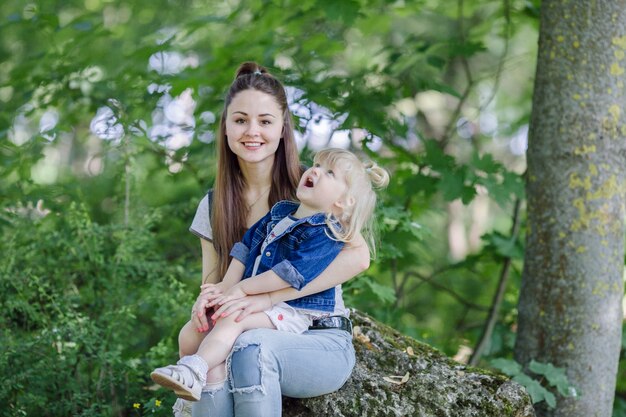 Woman with her daughter in arms