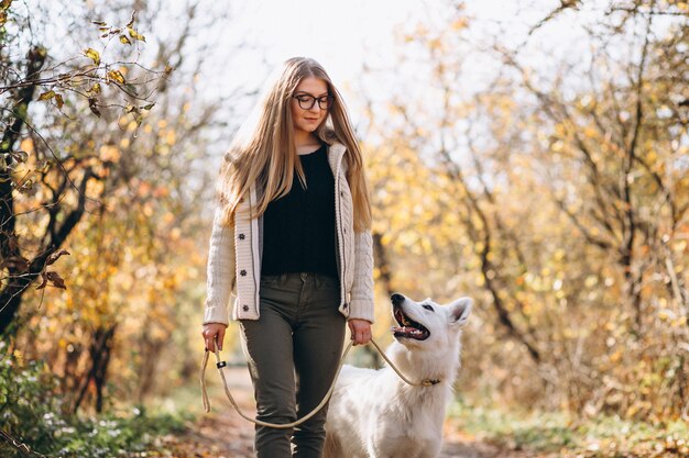 Woman with her dog walking in park