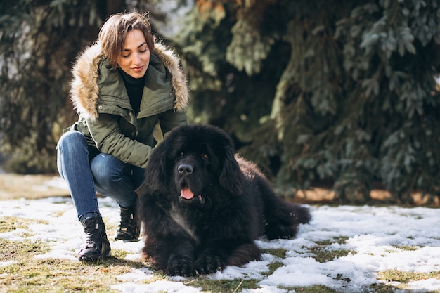 Woman with her dog walking in park