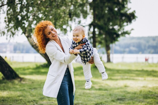 Woman with her son having fun in park