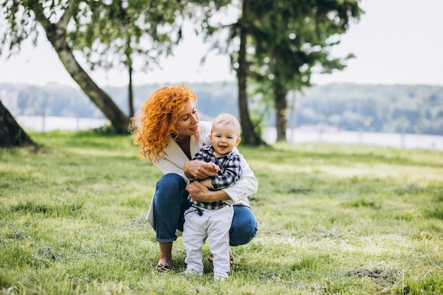 Free photo woman with her son having fun in park