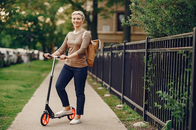 woman with kick scooter