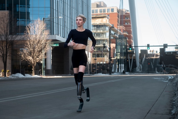 Woman with leg disability running in the city