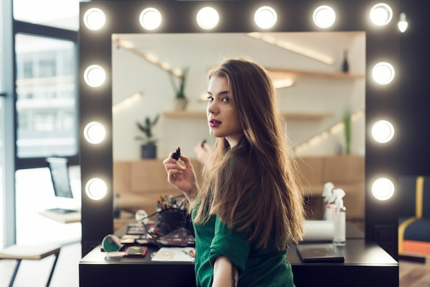 Woman with lipstick looking at camera