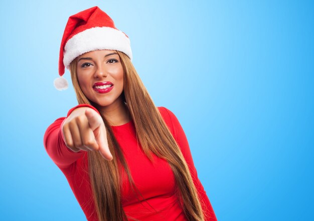 Woman with long hair pointing at somewhere