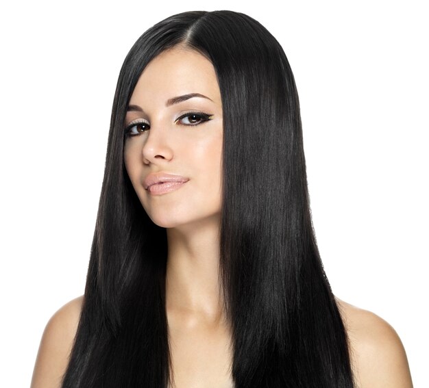 Woman with long straight hair. Fashion model posing at studio.