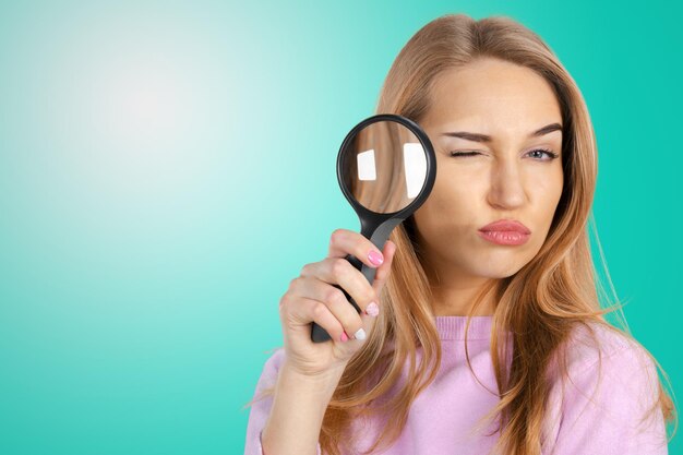 Woman with magnifying glass