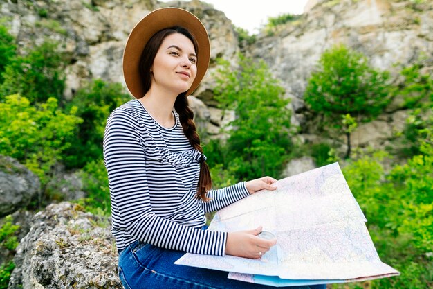 Woman with map in nature