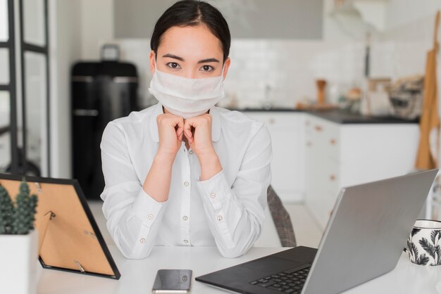 Woman with mask working