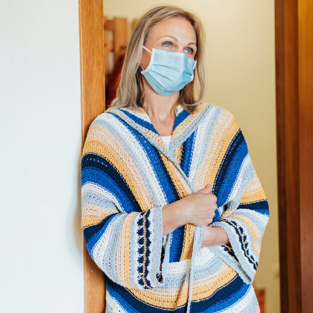 Woman with medical mask in quarantine